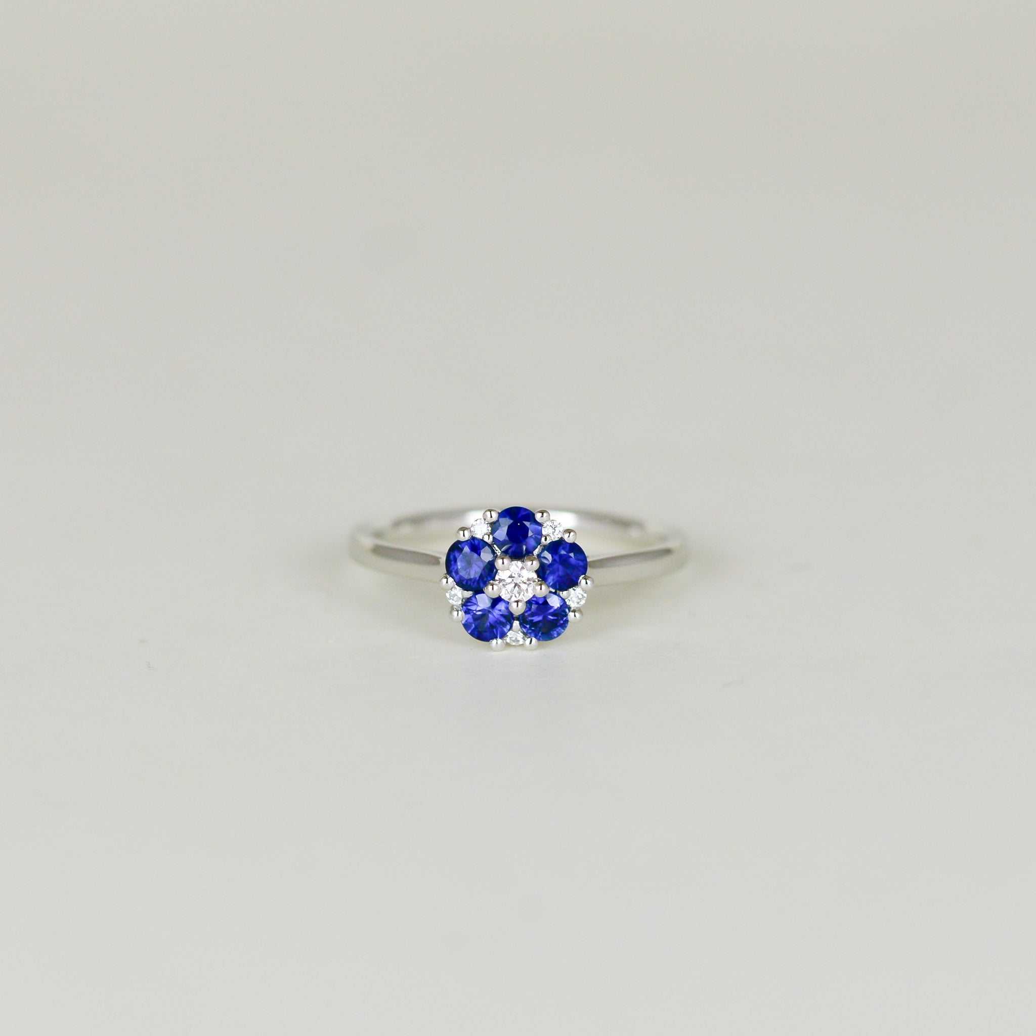 Platinum 0.73ct Round Sapphire and Diamond Daisy Style Cluster Ring Front