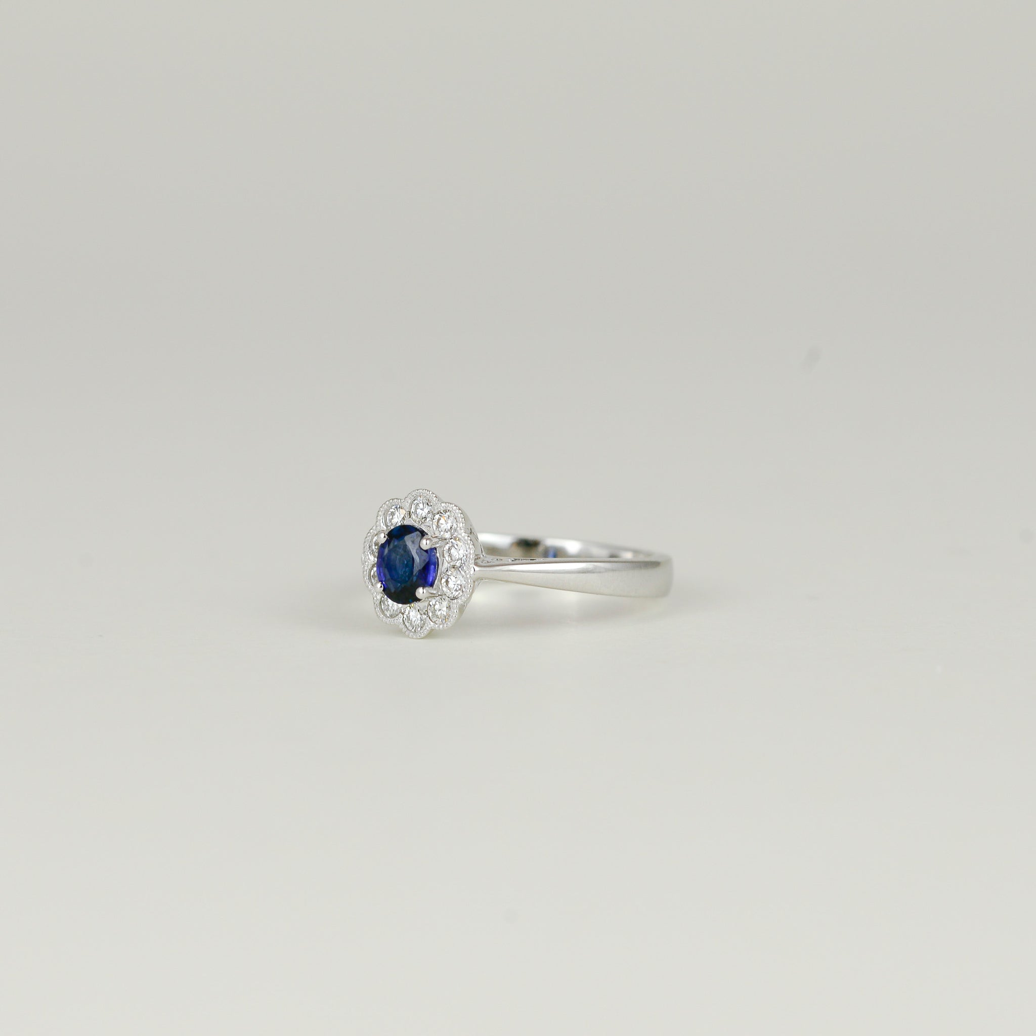 18ct White Gold 0.53ct Oval Sapphire and Diamond Cluster Ring