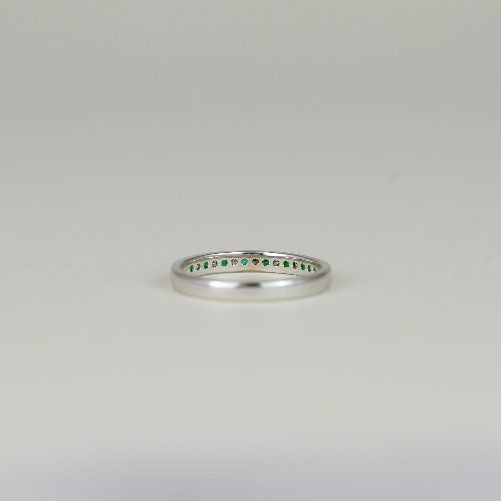 18ct White Gold 0.19ct Channel Set Emerald and Diamond Half Eternity Ring