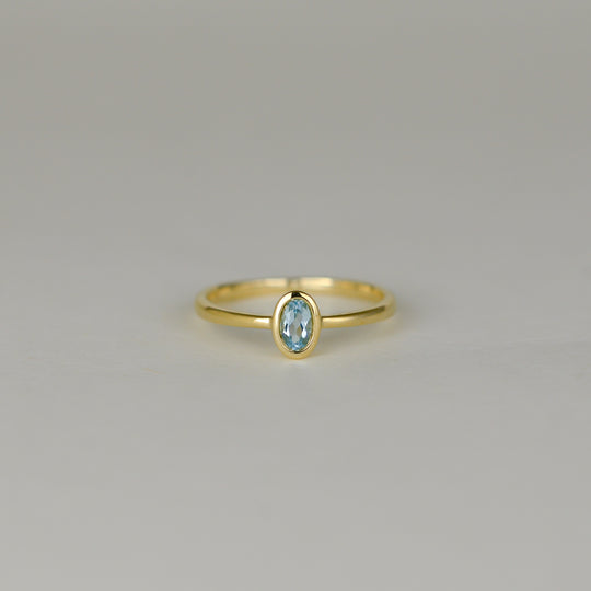 9ct Yellow Gold 0.28ct Rub Set Oval Blue Topaz Ring