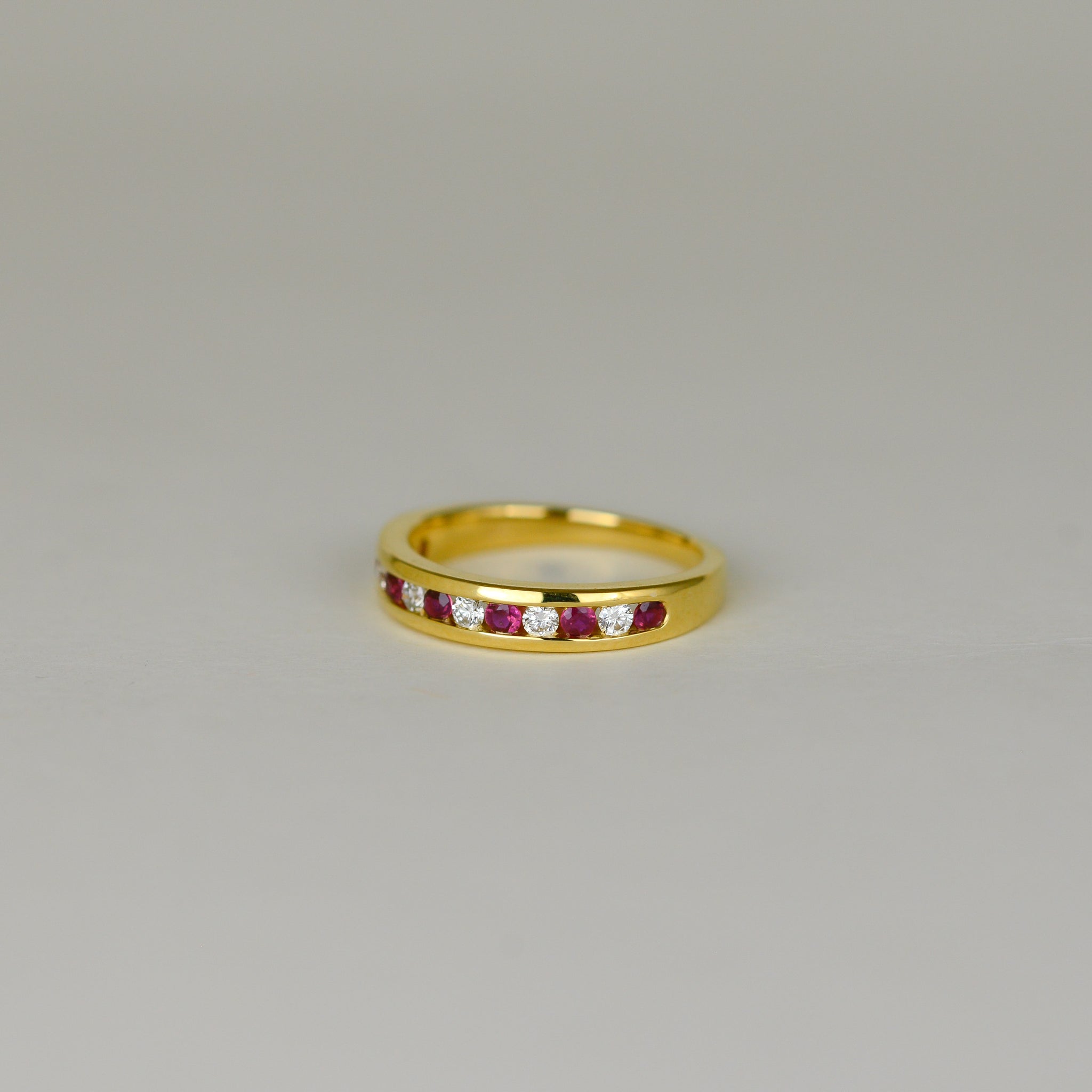 18ct Yellow Gold 0.28ct Round Ruby and Diamond Channel-Set Half Eternity Ring