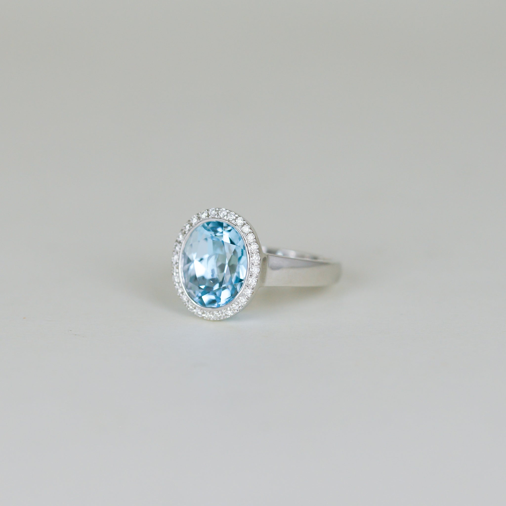 9ct White Gold 6.49ct Oval Blue Topaz and Diamond Dress Ring