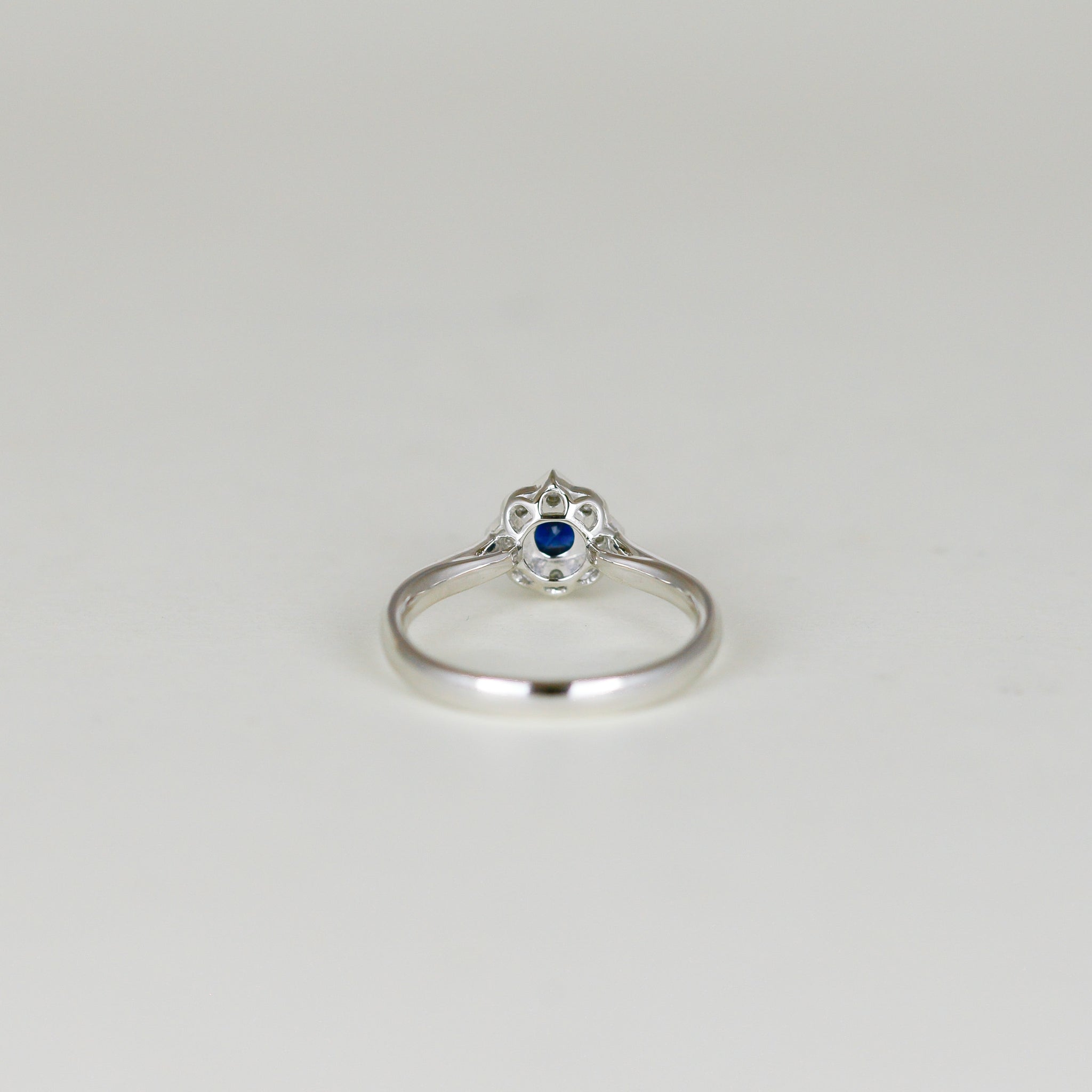 Platinum 0.30ct Round Sapphire and Diamond Cluster Ring