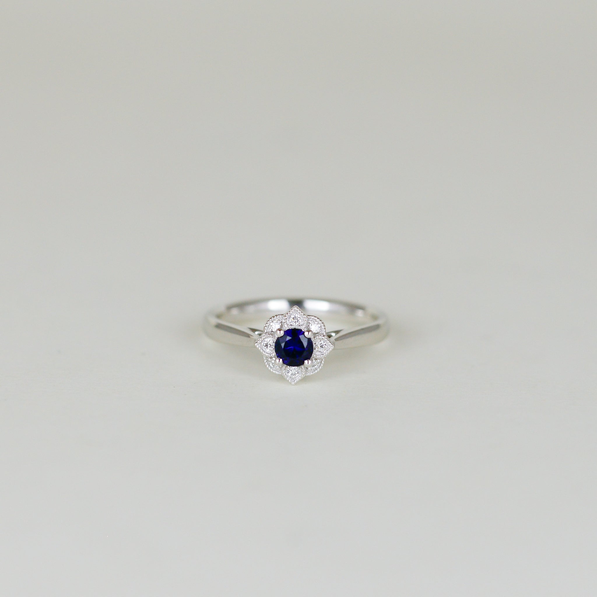 Platinum 0.30ct Round Sapphire and Diamond Cluster Ring