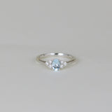 9ct White Gold 0.50ct Oval Blue Topaz and Diamond Cluster Ring