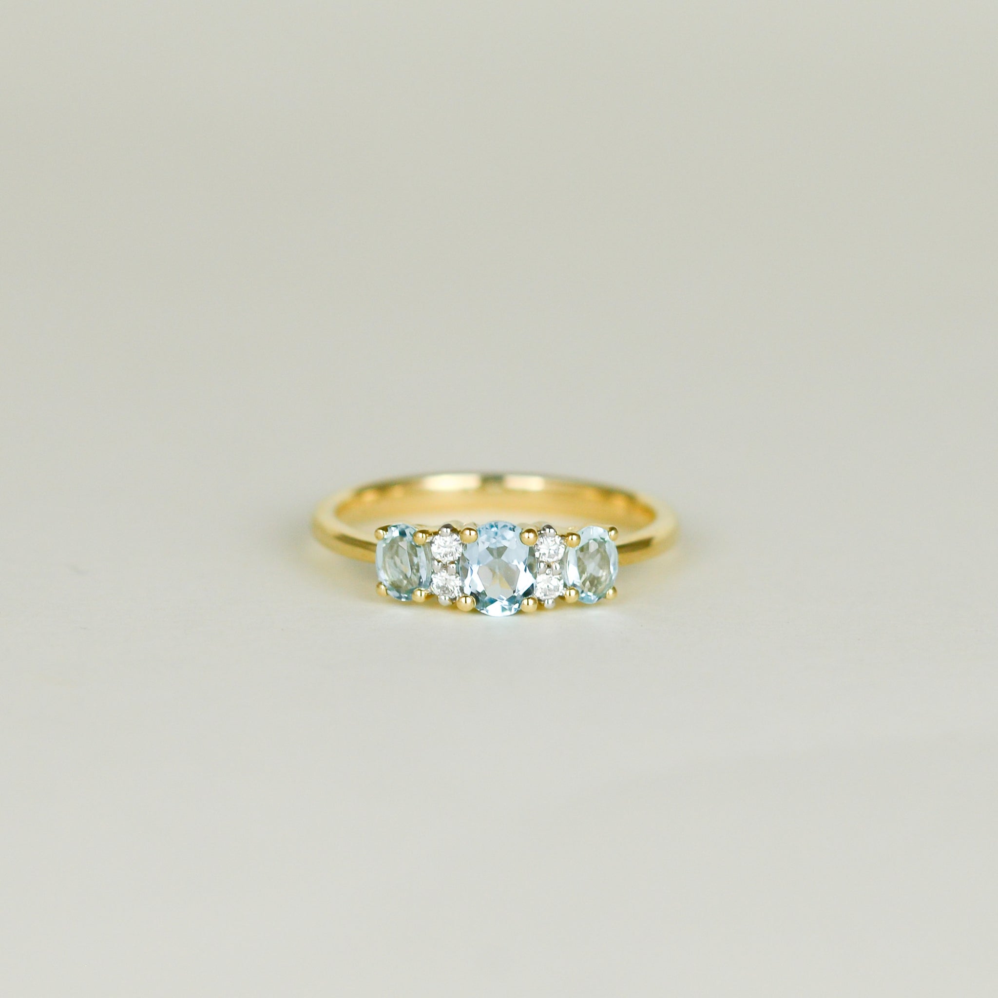 9ct Yellow Gold 0.89ct Oval Blue Topaz and Diamond Three Stone Dress Ring