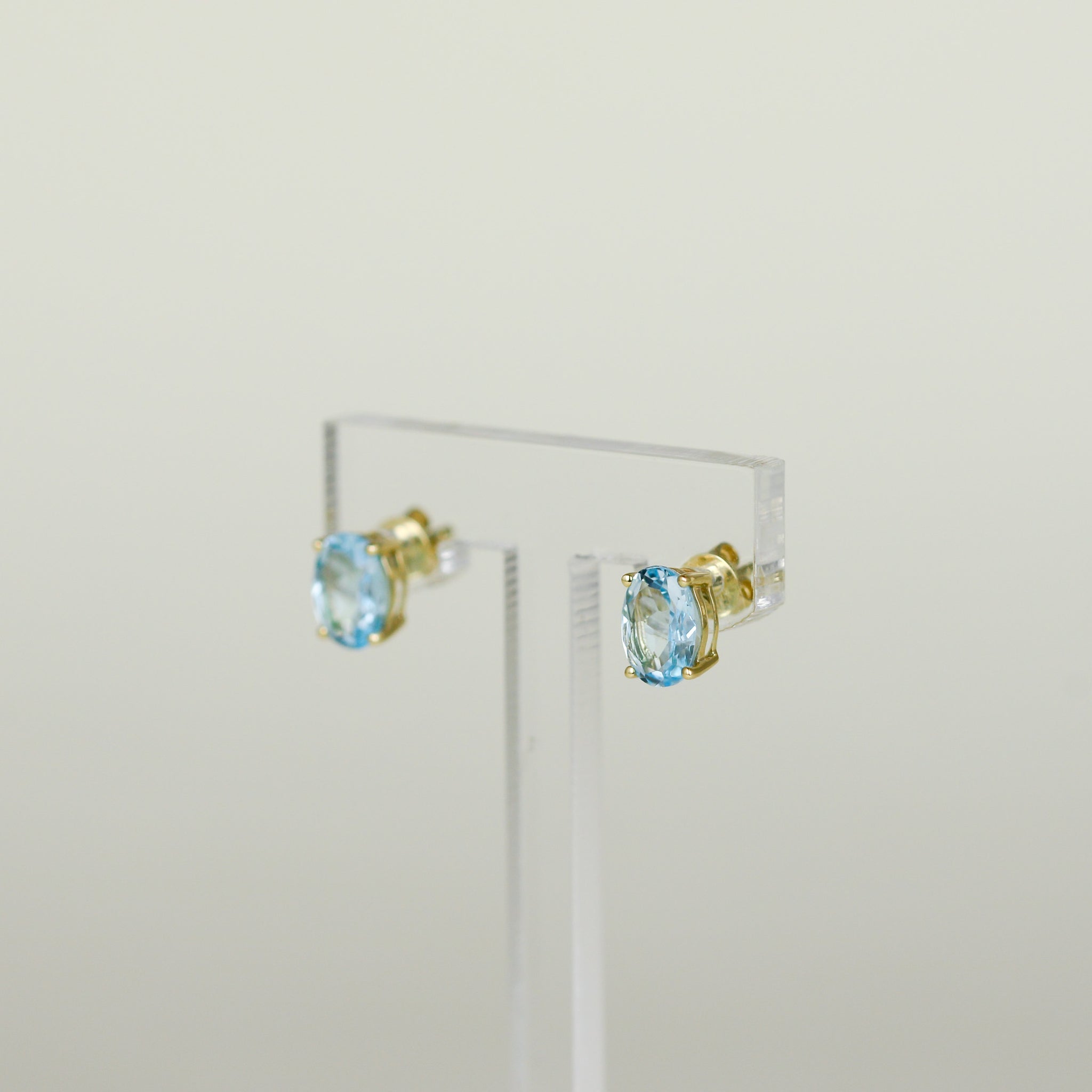 9ct Yellow Gold 2.58ct Oval Blue Topaz Stud Earrings