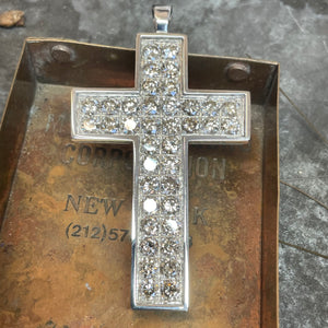 <br><h3>
A chunky diamond encrusted
cross pendant</h3><br>
A beautiful way to show your faith and making great use of diamonds
