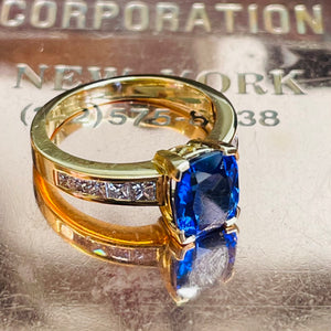 <br><h3>
A vivid blue sapphire and diamond ring</h3><br>
A cushion cut sapphire and channel set diamonds
take centre stage