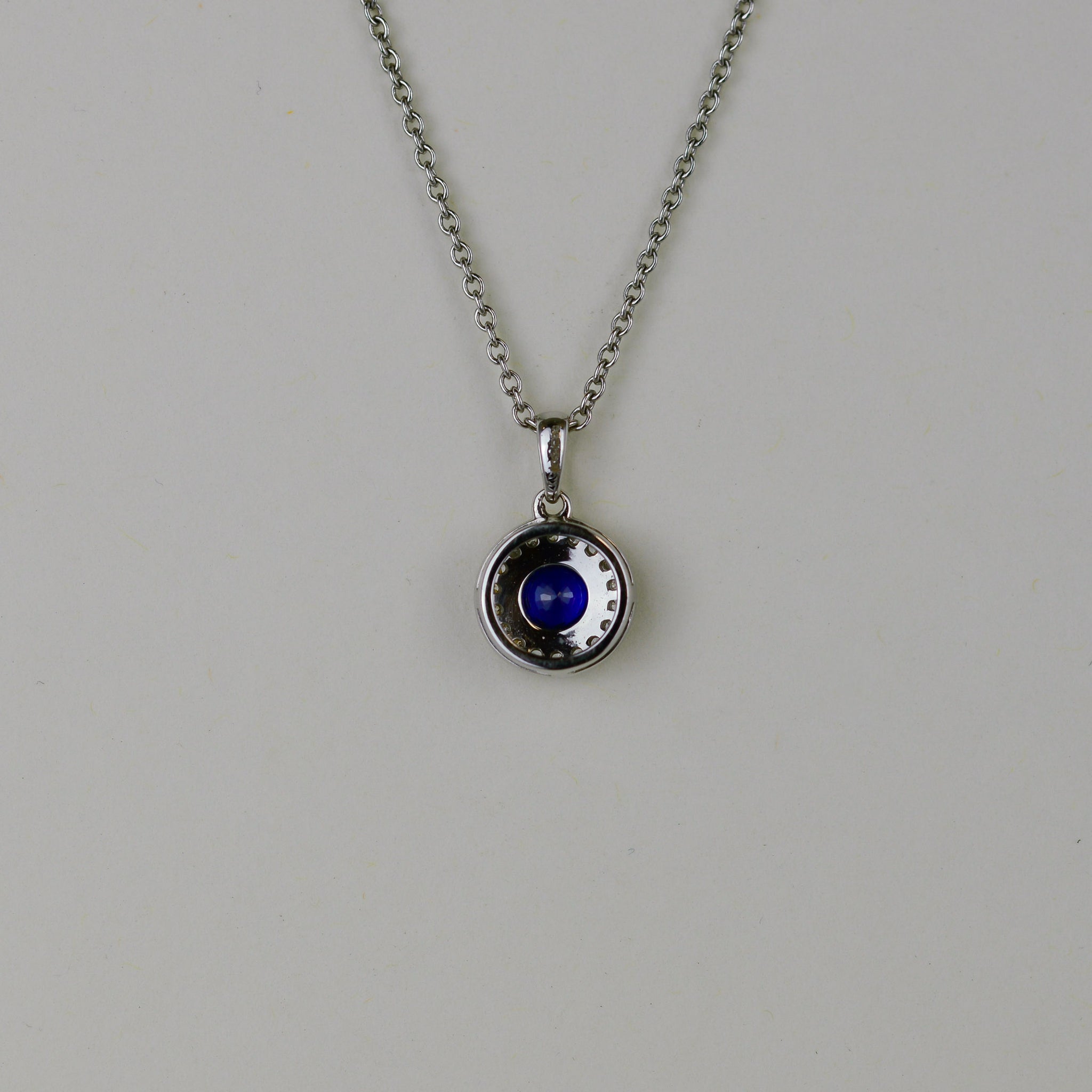 18ct White Gold 0.31ct Sapphire and Diamond Halo Pendant