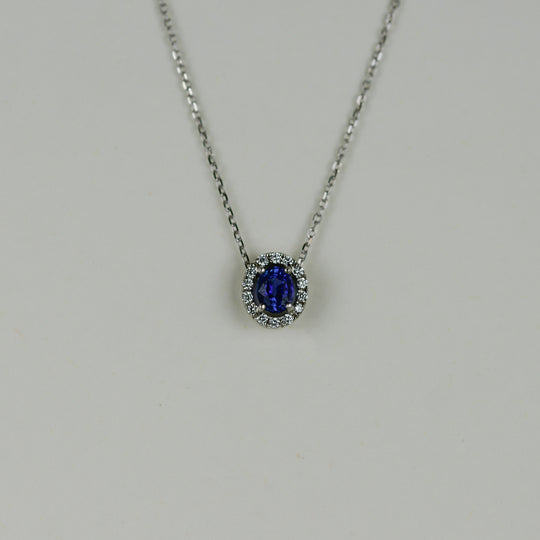 18ct White Gold 0.86ct Sapphire and Diamond Halo Pendant