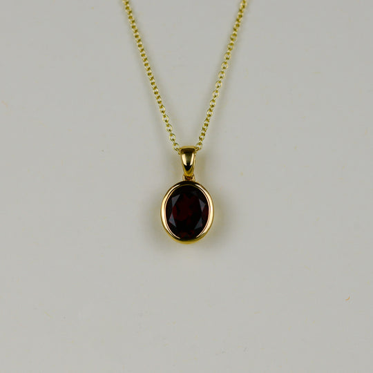 9ct Yellow Gold 2.81ct Oval Rub Set Garnet Pendant