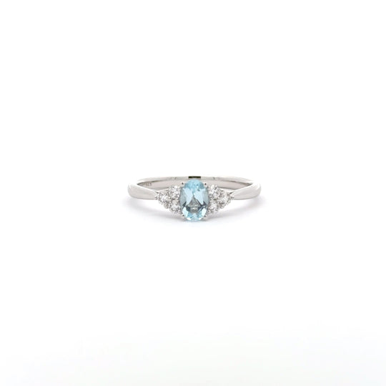 9ct White Gold 0.50ct Oval Blue Topaz and Diamond Cluster Ring