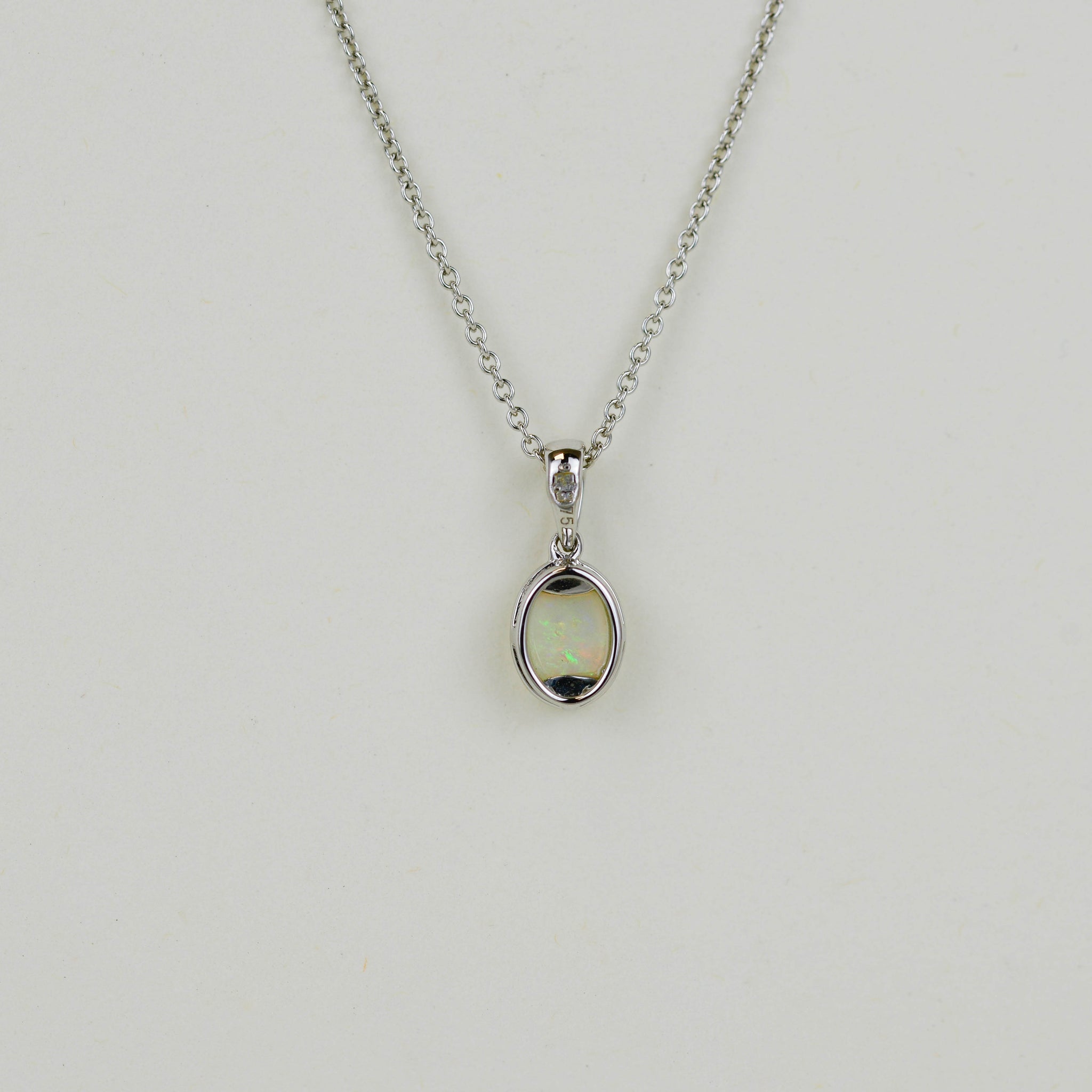 9ct White Gold 0.45ct Rub Set Oval Opal Pendant