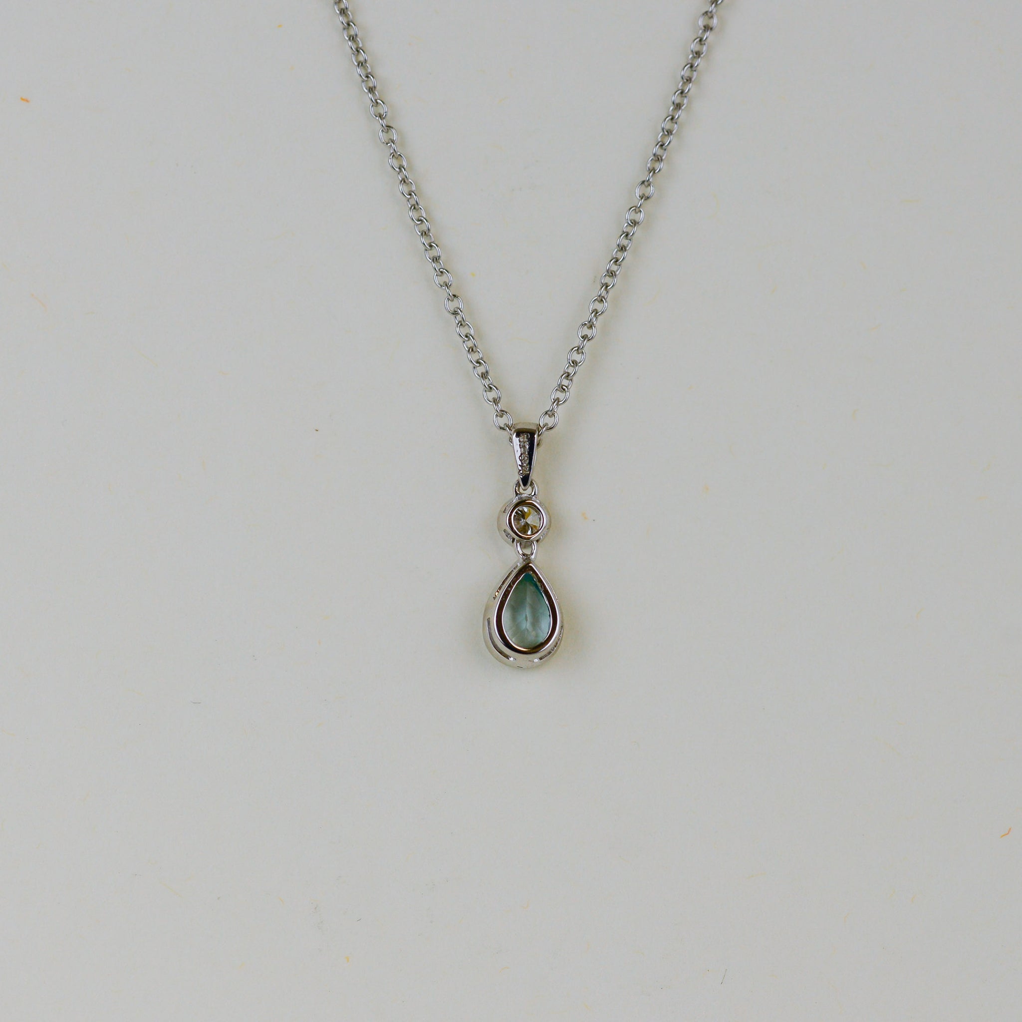 9ct White Gold 0.50ct Pear Blue Topaz and Diamond Drop Pendant