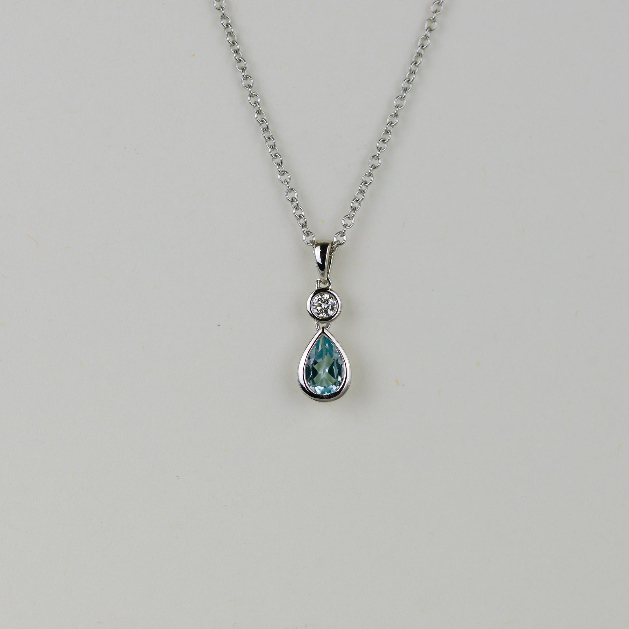 9ct White Gold 0.50ct Pear Blue Topaz and Diamond Drop Pendant