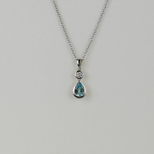 9ct White Gold 0.49ct Pear Blue Topaz and Diamond Drop Pendant