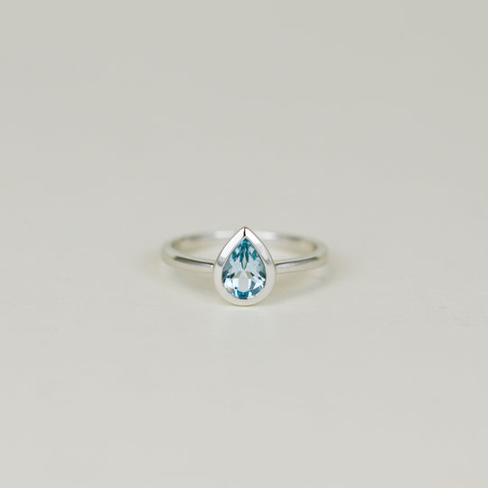 9ct White Gold 0.79ct Pear Cut Rub Set Blue Topaz Ring