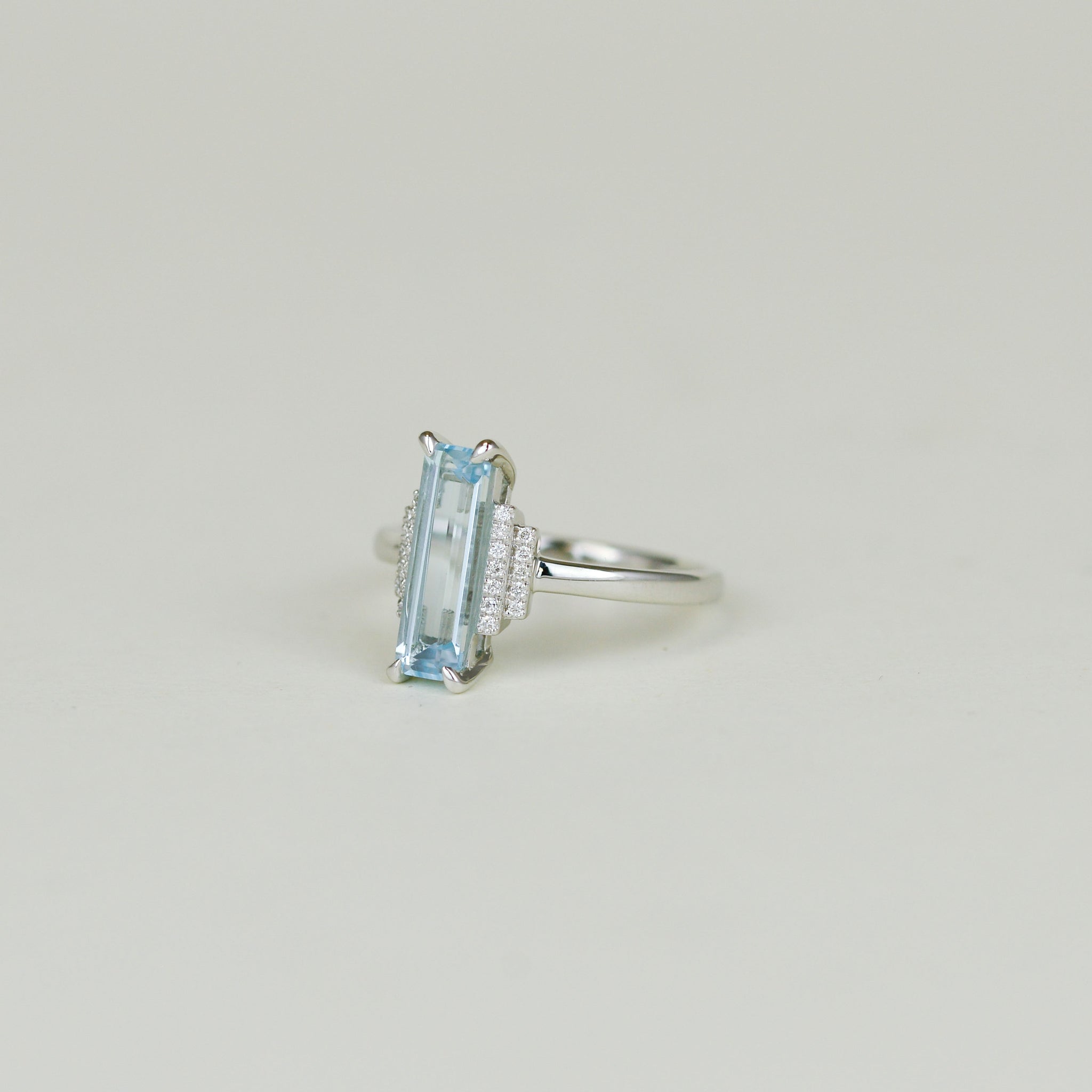 9ct White Gold 1.78ct Elongated Emerald Cut Blue Topaz and Diamond Dress Ring