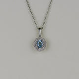 18ct White Gold 0.32ct Oval Aquamarine and Diamond Cluster Pendant