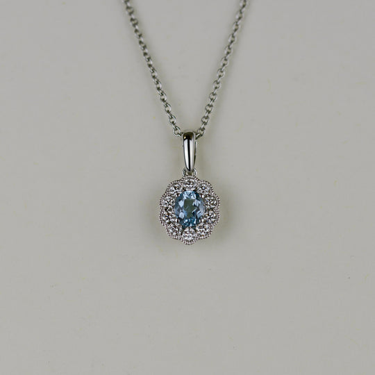 18ct White Gold 0.32ct Oval Aquamarine and Diamond Cluster Pendant