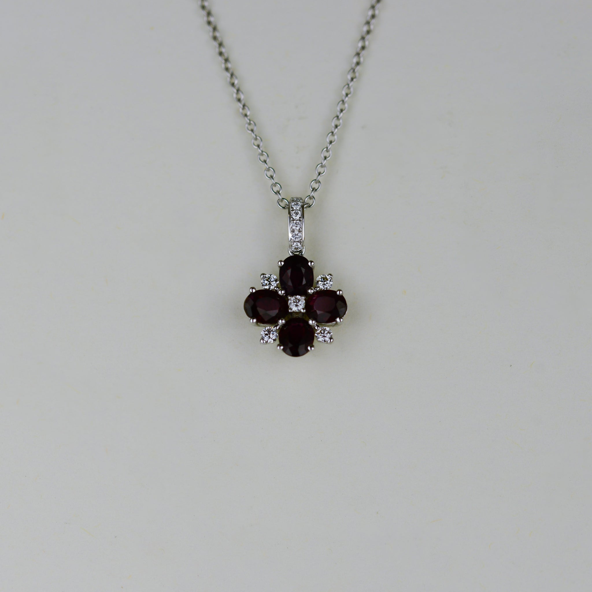 18ct White Gold 1.53ct Oval Ruby and Diamond Flower Pendant