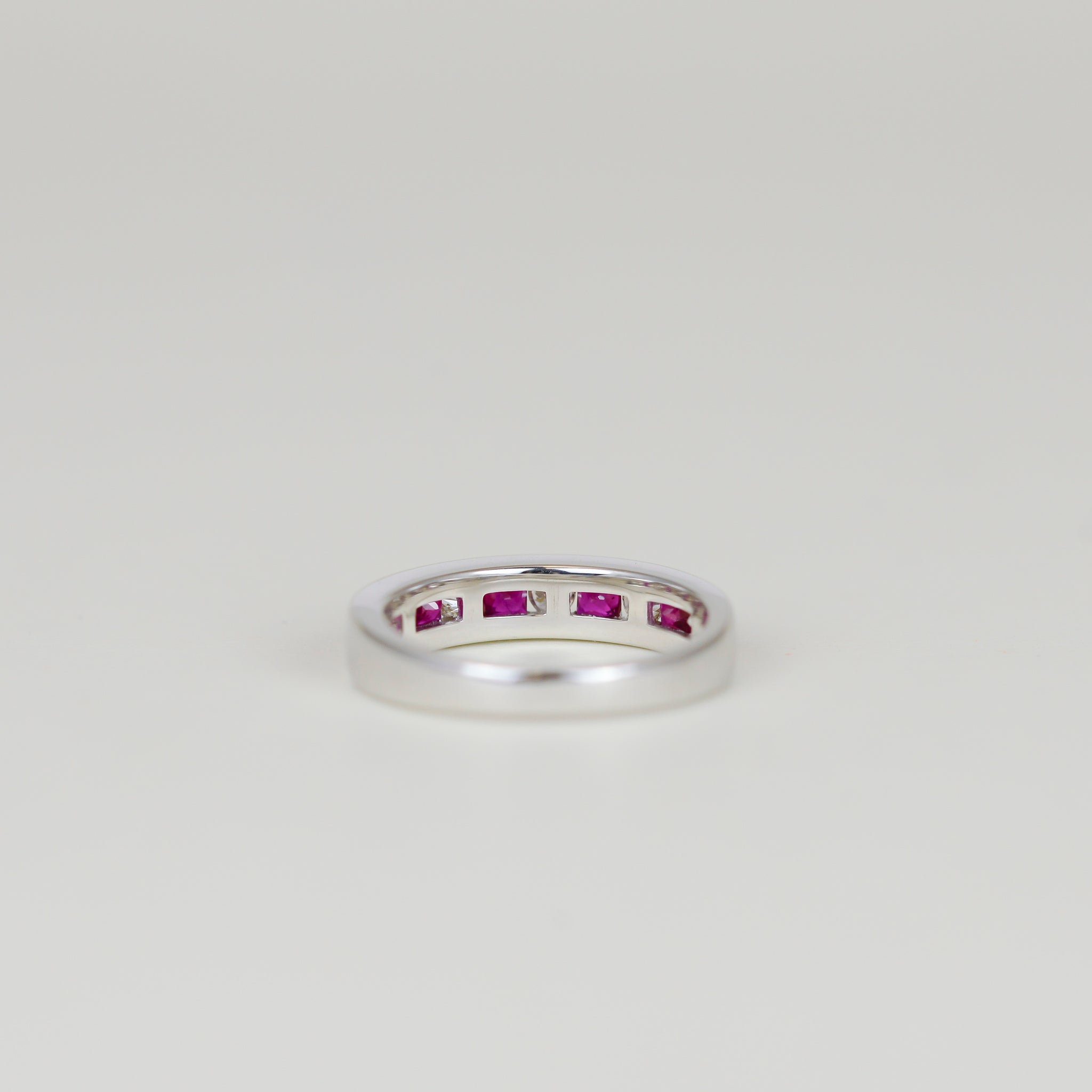 18ct White Gold 0.56ct Channel Set Ruby and Diamond Half Eternity Ring