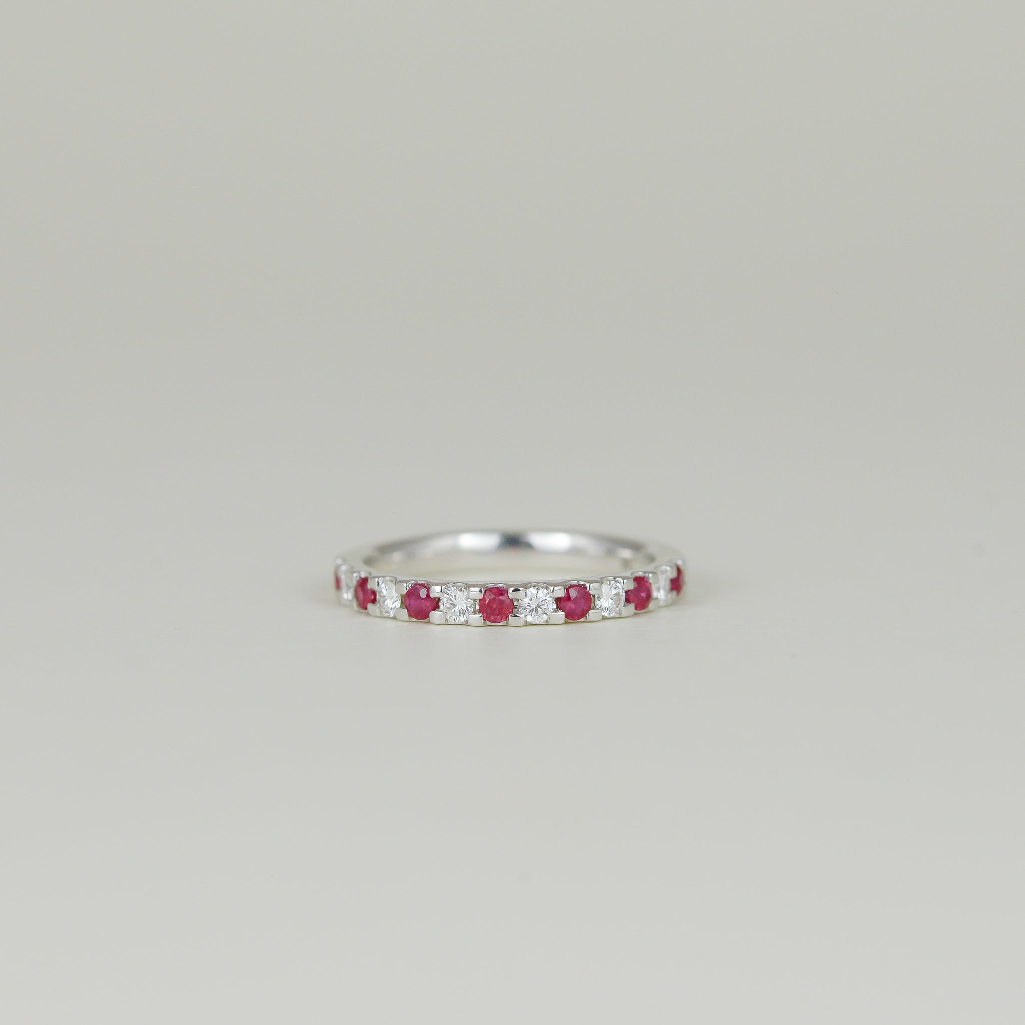 18ct White Gold 0.19ct Round Ruby and Diamond Castle-Set Eternity Band