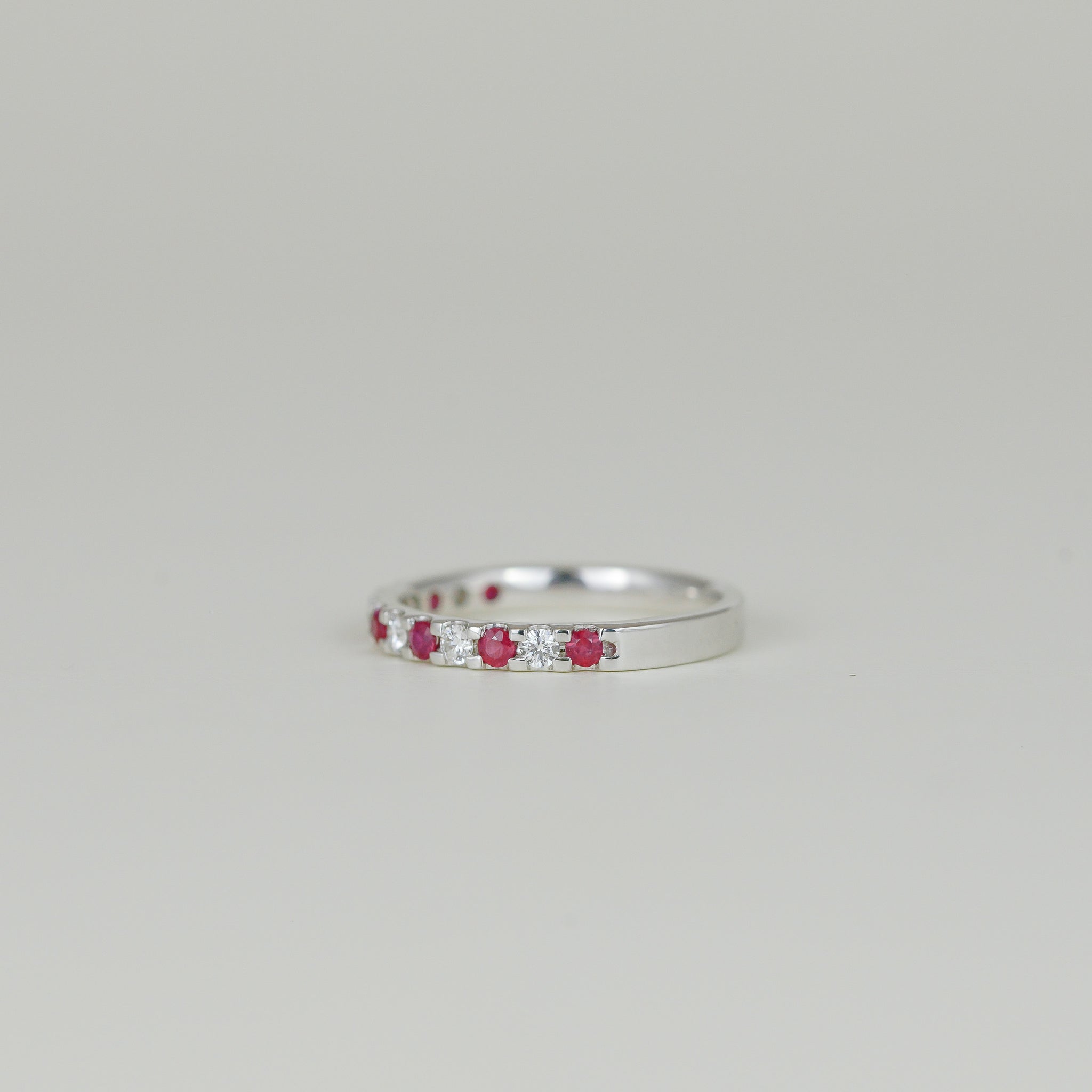 18ct White Gold 0.19ct Round Ruby and Diamond Castle-Set Eternity Band