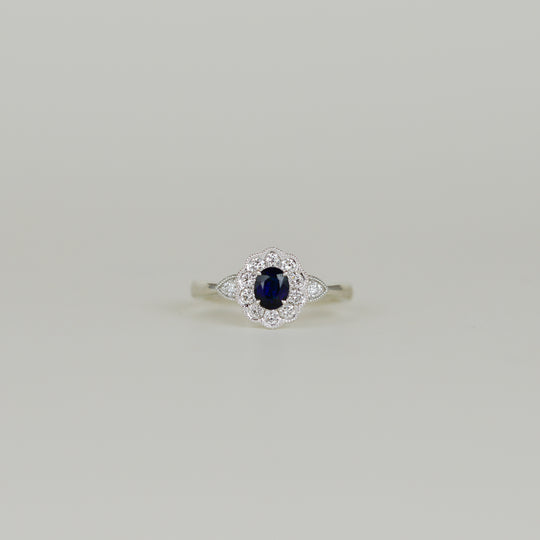 18ct White Gold 0.45ct Oval and Sapphire Cluster Ring