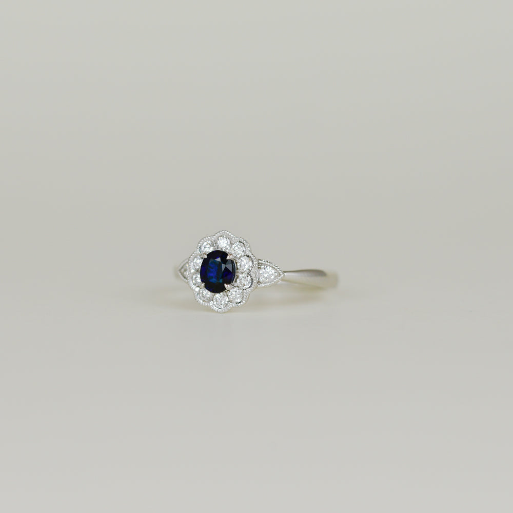 18ct White Gold 0.45ct Oval and Sapphire Cluster Ring