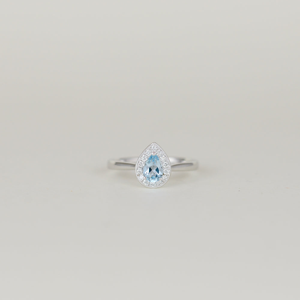 9ct White God 0.43ct Pear Blue Topaz and Diamond Cluster Ring