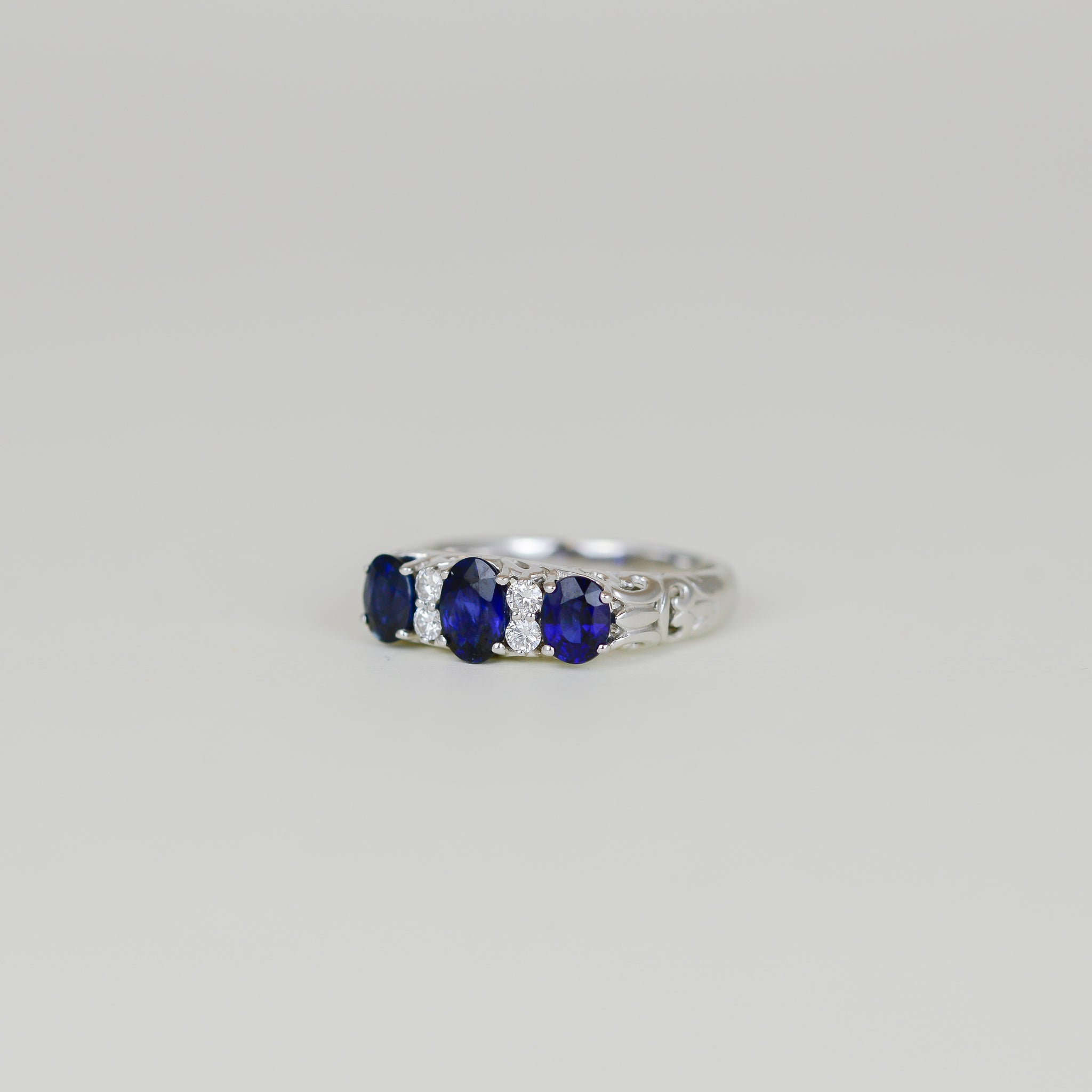 White Gold 1.62ct Oval Sapphire and Diamond Carved Claw Dress Ring