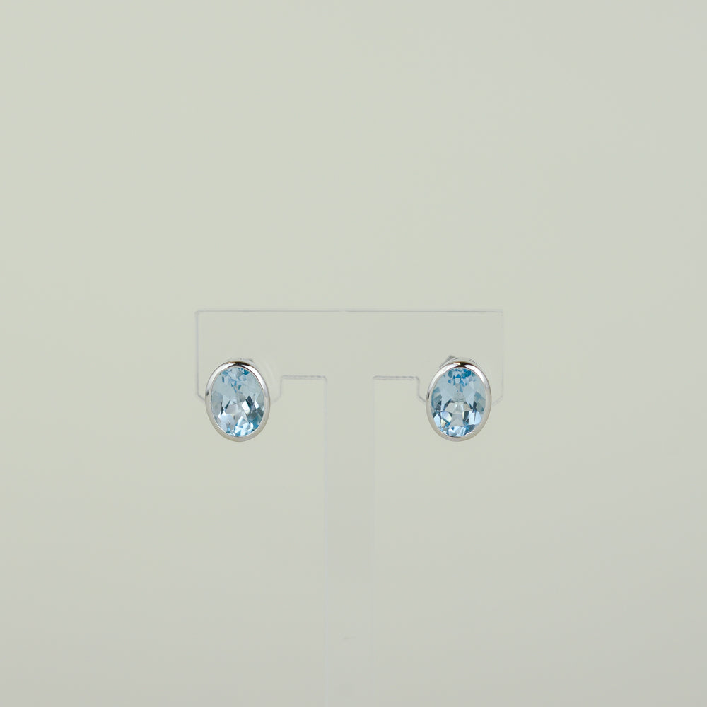 9ct White Gold 3.14ct Oval Rub-Set Blue Topaz Earrings