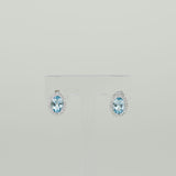 9ct White Gold 1.80ct Oval Blue Topaz and Diamond Halo Stud Earrings