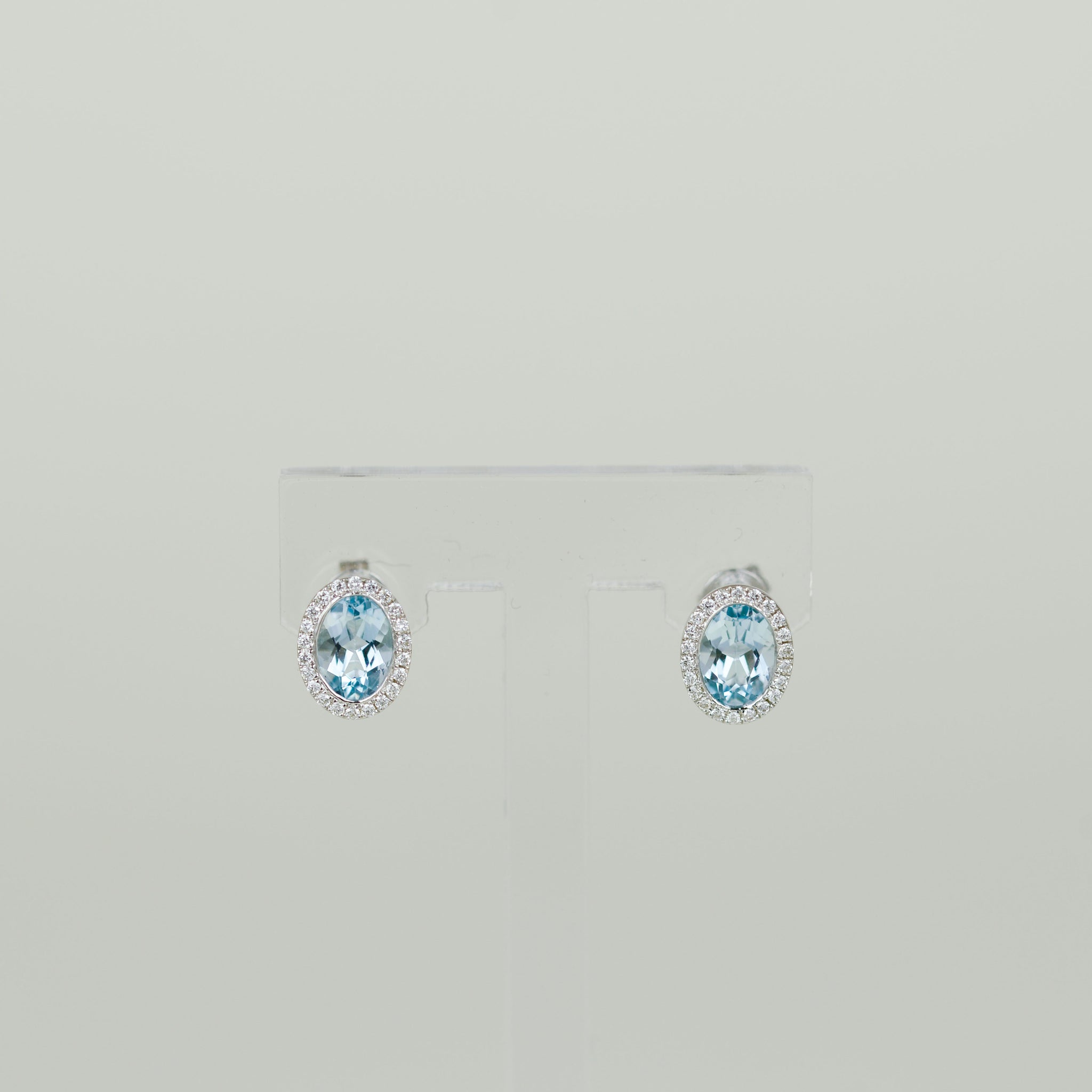 9ct White Gold 1.80ct Oval Blue Topaz and Diamond Halo Stud Earrings