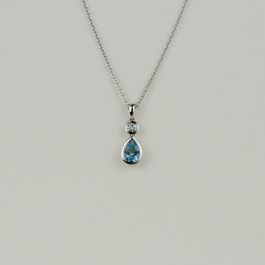18ct White Gold 0.48ct Pear Cut Blue Topaz and Diamond Pendant