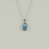 9ct White Gold 3.51ct Oval Rub-Set Blue Topaz Pendant