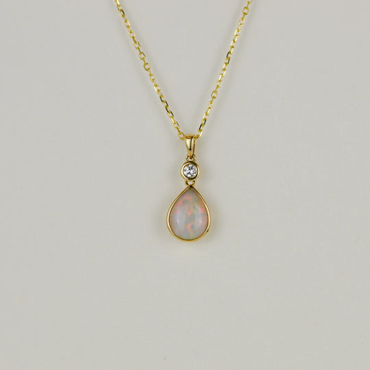 9ct Yellow Gold 0.84ct Pear Cut Opal and Diamond Pendant