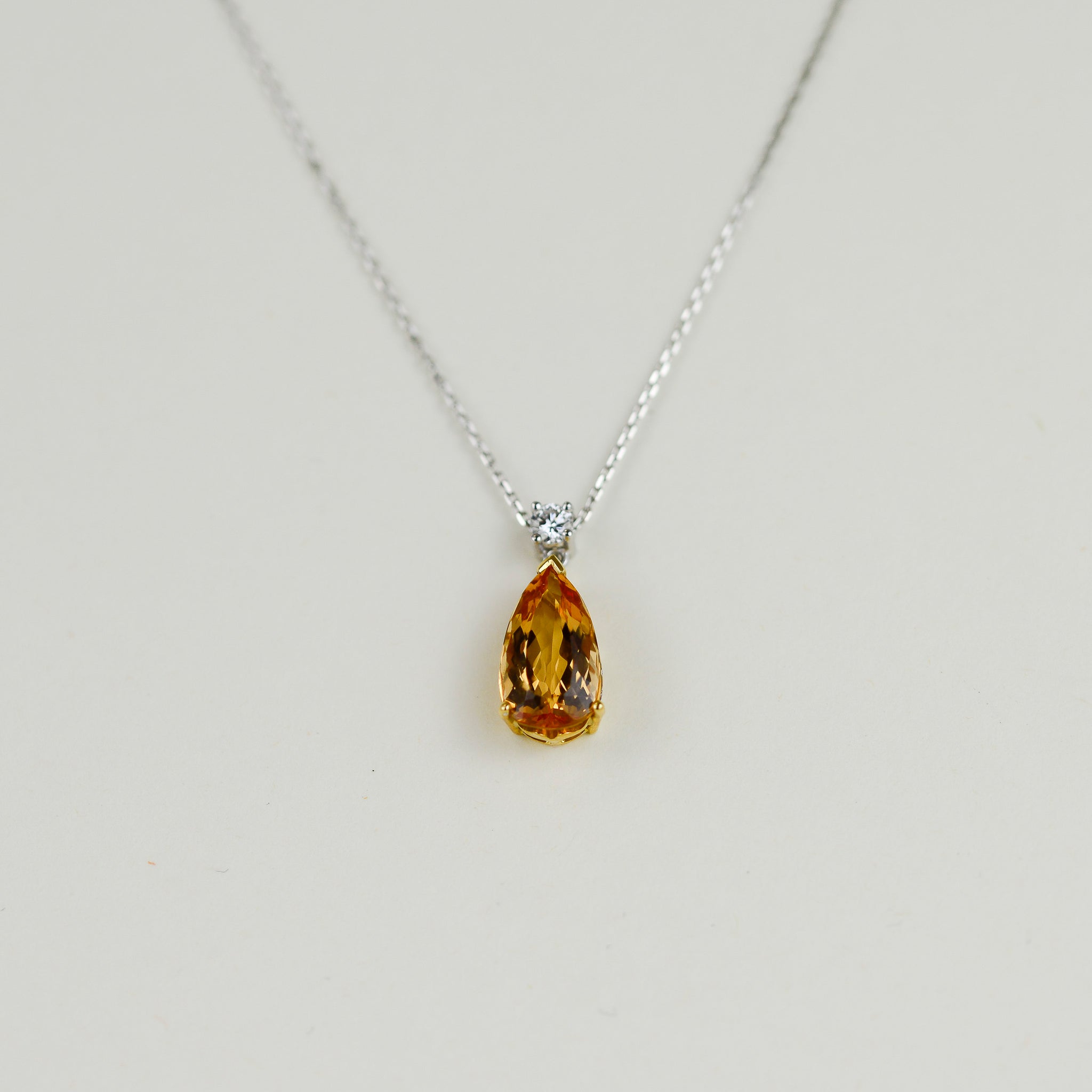 18ct Yellow & White Gold 4.61ct Pear Cut Imperial Topaz and 0.16ct Diamond Pendant