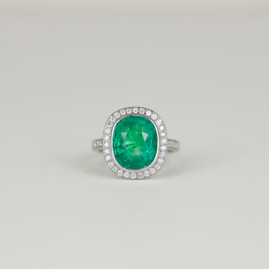 Platinum 7.08ct Emerald and Diamond Cluster Ring