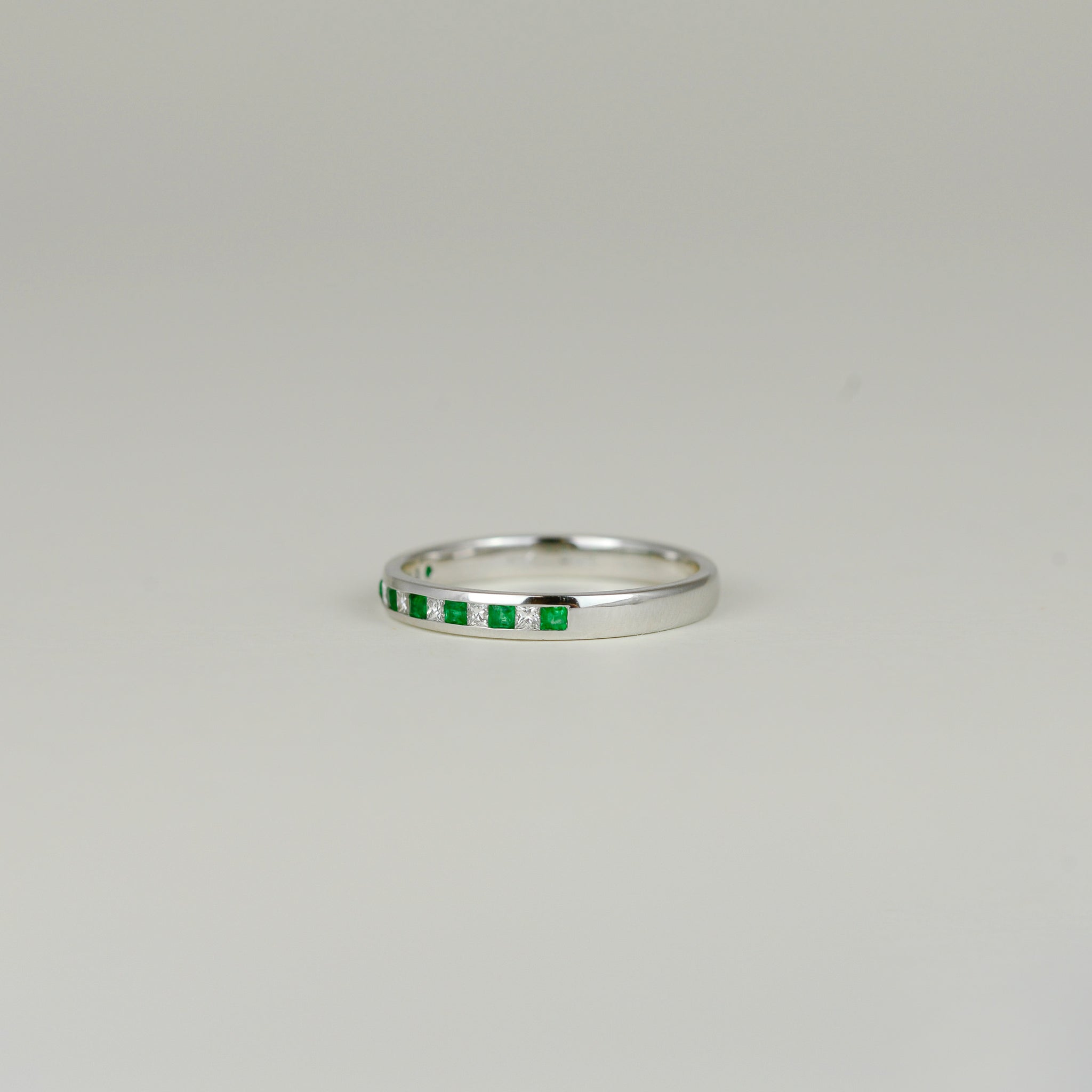 18ct White Gold 0.19ct Channel Set Emerald and Diamond Half Eternity Ring