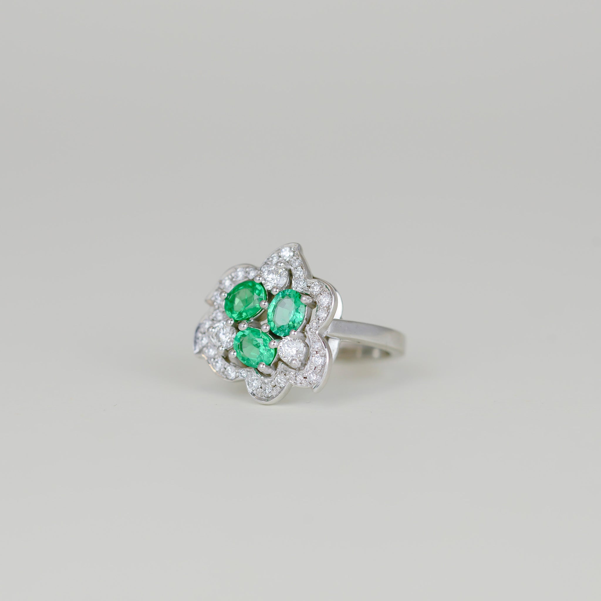 18ct White Gold 0.90ct Oval Emerald and Diamond Flower Dress Ring