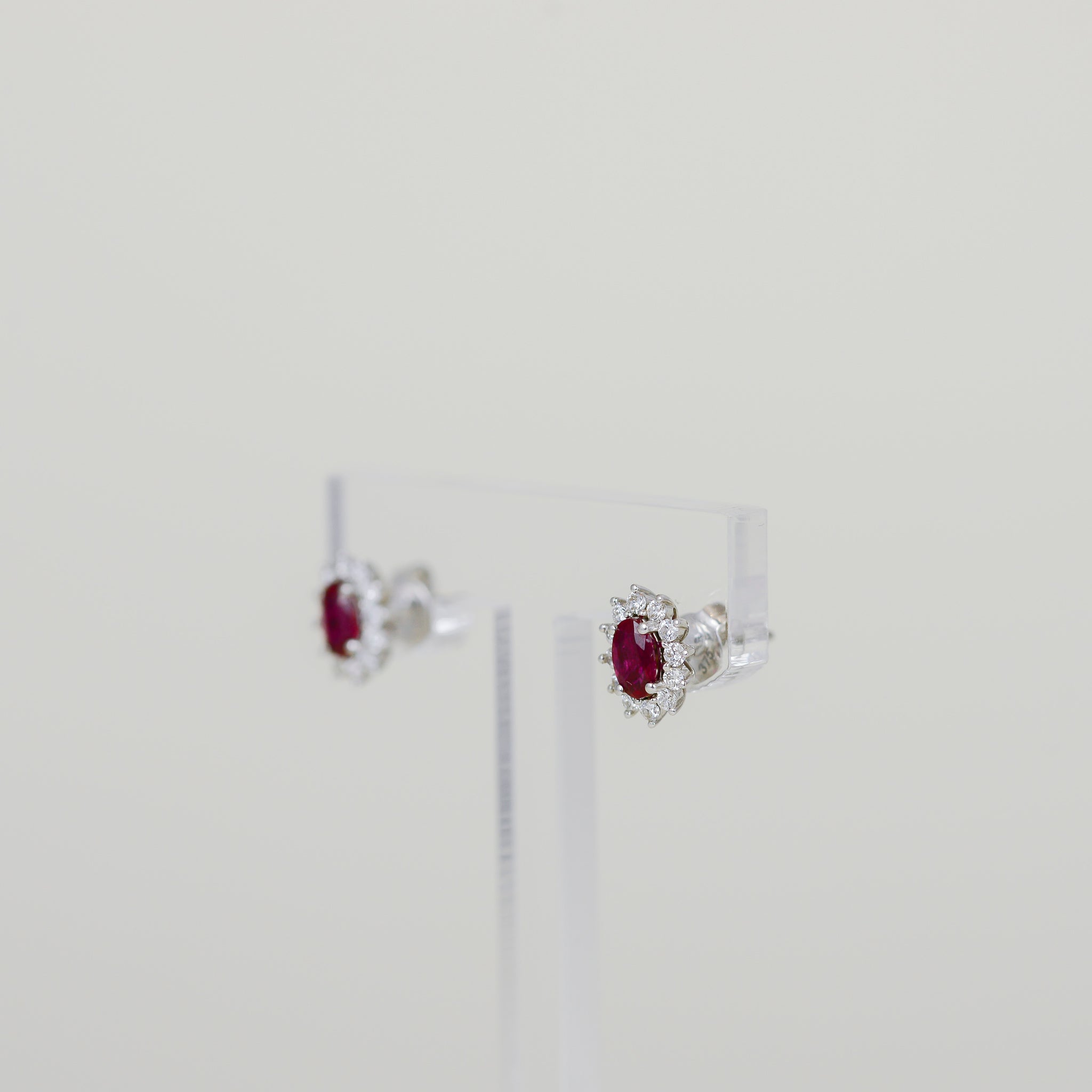 9ct White Gold 0.55ct Oval Ruby and Diamond Cluster Earrings